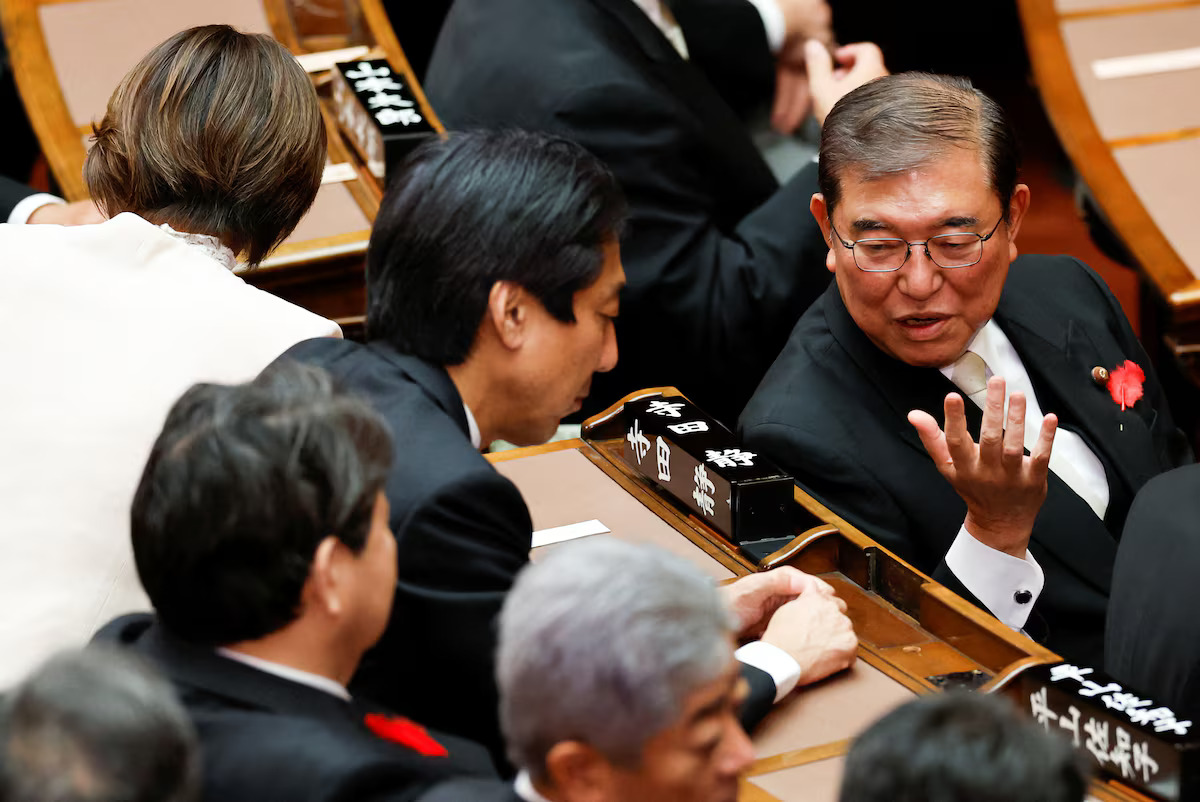 Japan's new Prime Minister Shigeru Ishiba talks to ministers ahead of his first policy speech at the upper house of the parliament in Tokyo, Japan, October 4, 2024. /Reuters