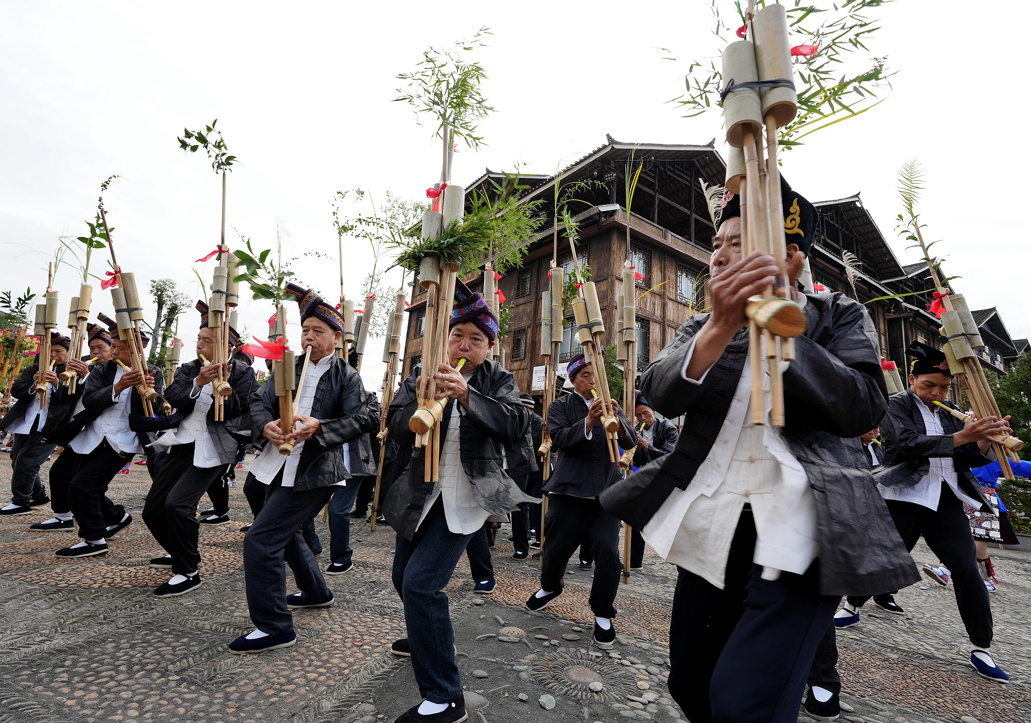 People play the lusheng for National Day celebrations in Liuzhou, Guangxi on October 2, 2024. /CFP  