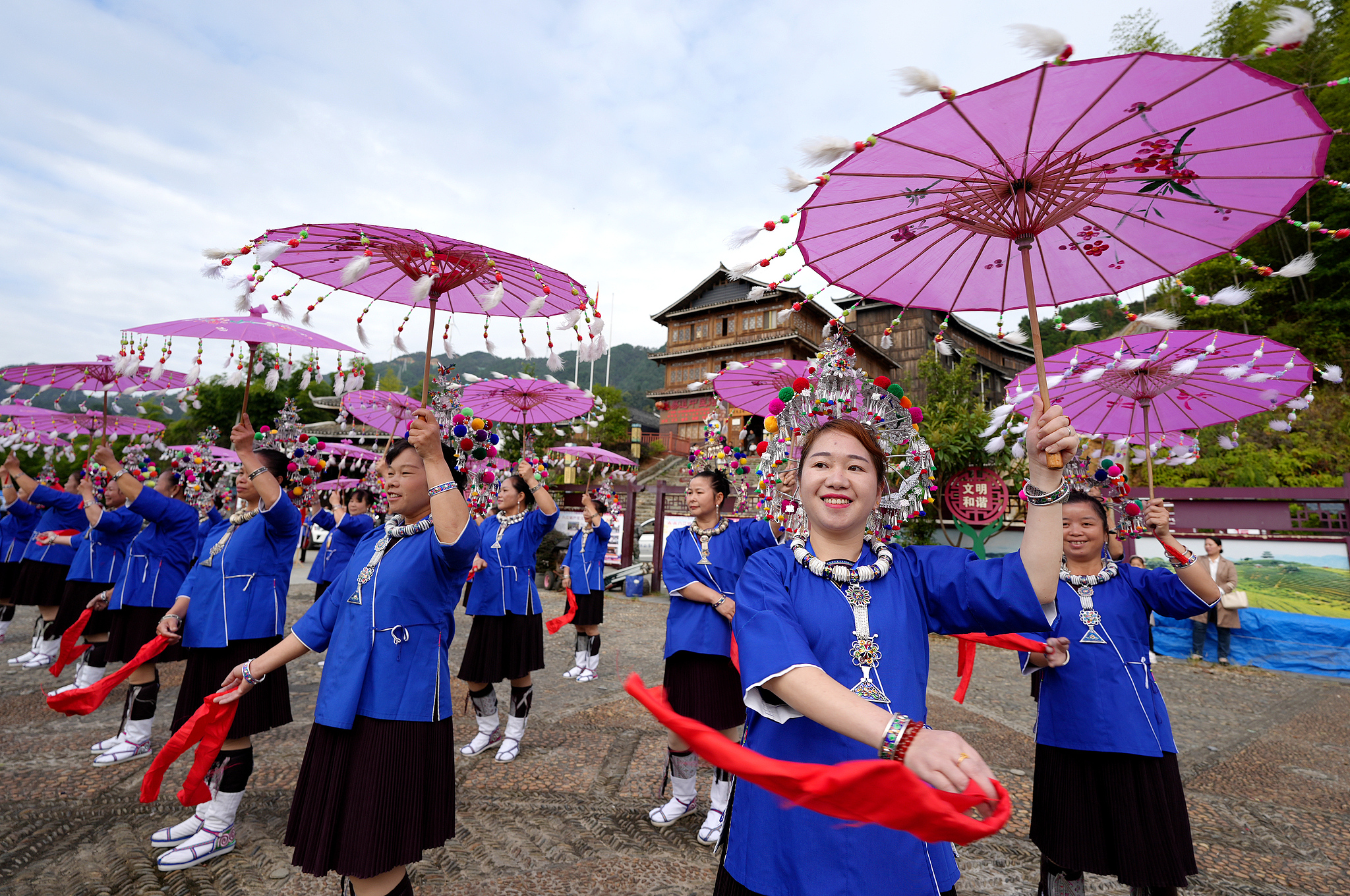 Local people perform the Lusheng Caitang, a traditional dance that features lusheng accompaniment, for National Day celebrations in Liuzhou, Guangxi on October 2, 2024. /CFP  