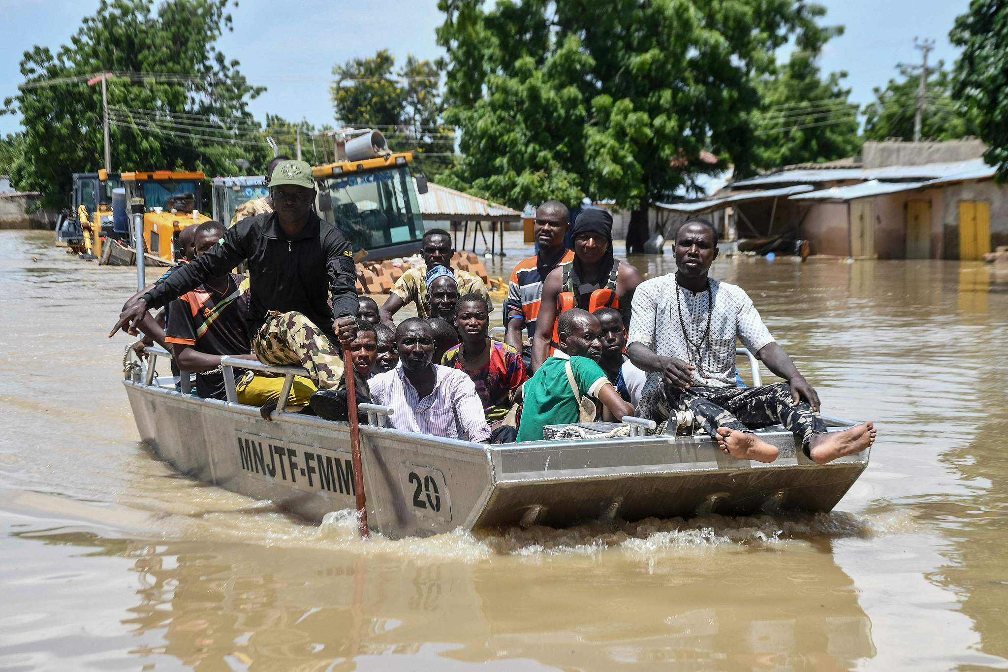 People affected by floods are escorted through flood water on a military boat in Maiduguri, Nigeria, September 12, 2024. /CFP