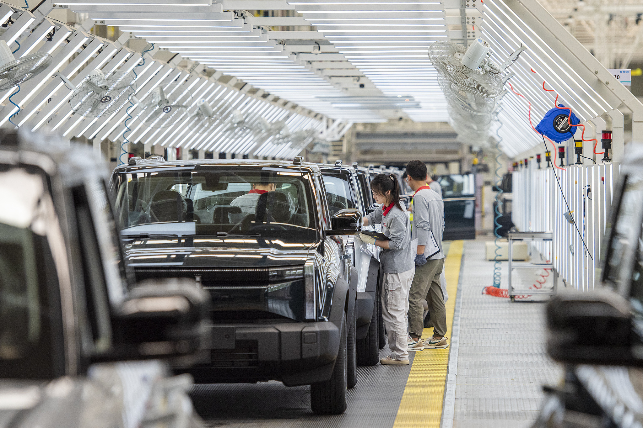 Workers assemble new-energy vehicles in Wuhu City, Anhui Province, China, May 23, 2024. /CFP