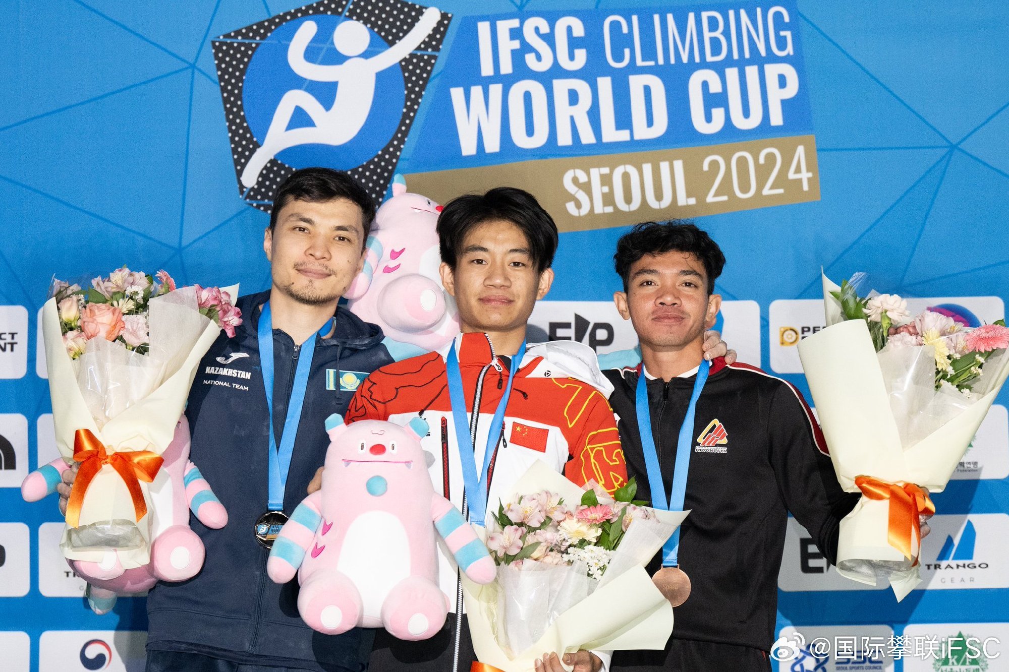 L-R: Men's speed silver medalist Amir Maimuratov of Kazakhstan, gold medalist Wang Xinshang of China and bronze medalist Kiromal Katibin of Indonesia pose for a photo at the International Federation of Sport Climbing (IFSC) Climbing World Cup in Seoul, South Korea, October 4, 2024. /International Federation of Sport Climbing