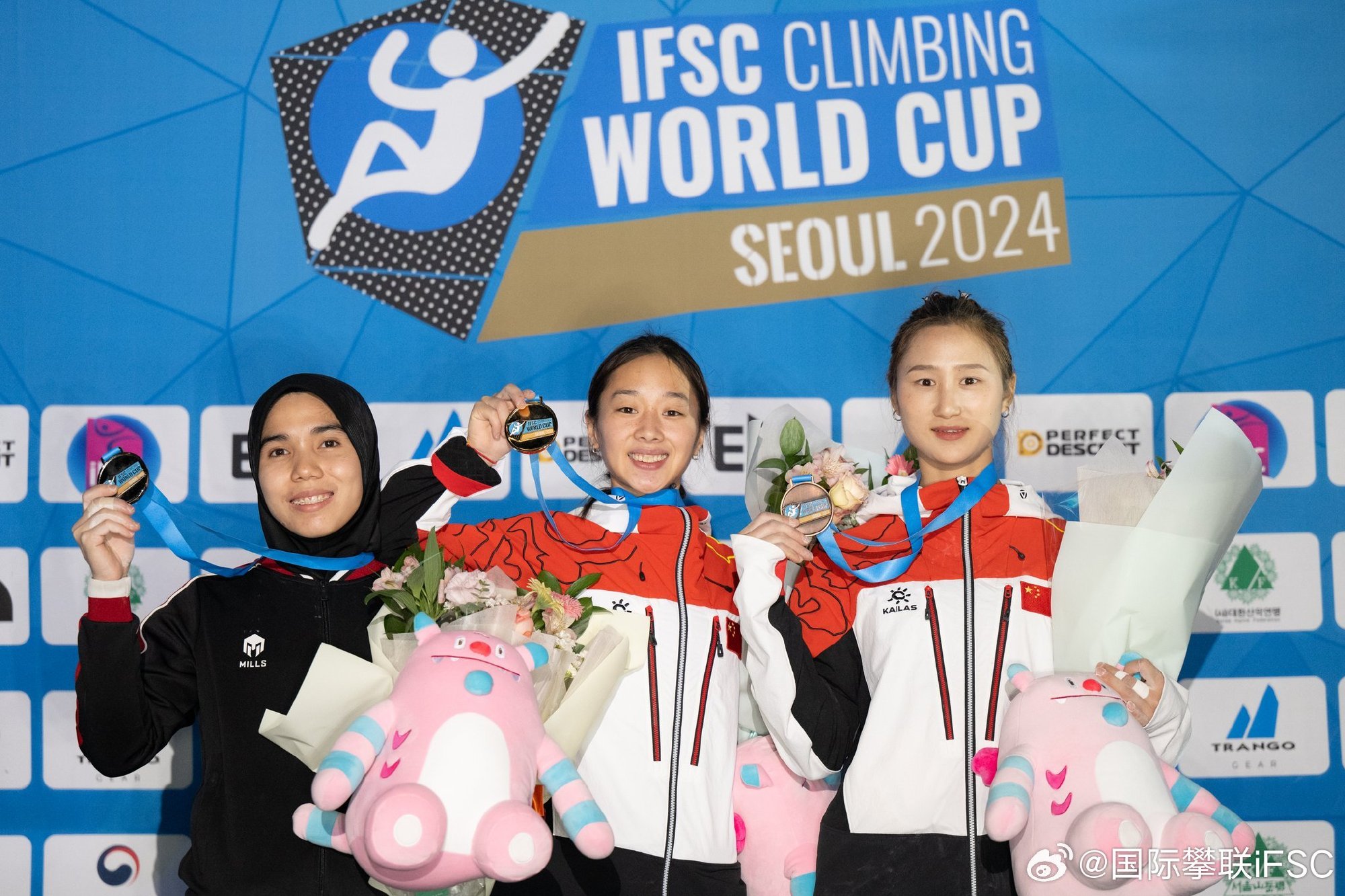 L-R: Women's speed silver medalist Rajiah Sallsabillah of Indonesia, gold medalist Zhou Yafei of China and bronze medalist Wang Shengyan of China pose for a photo at the International Federation of Sport Climbing (IFSC) Climbing World Cup in Seoul, South Korea, October 4, 2024. /International Federation of Sport Climbing