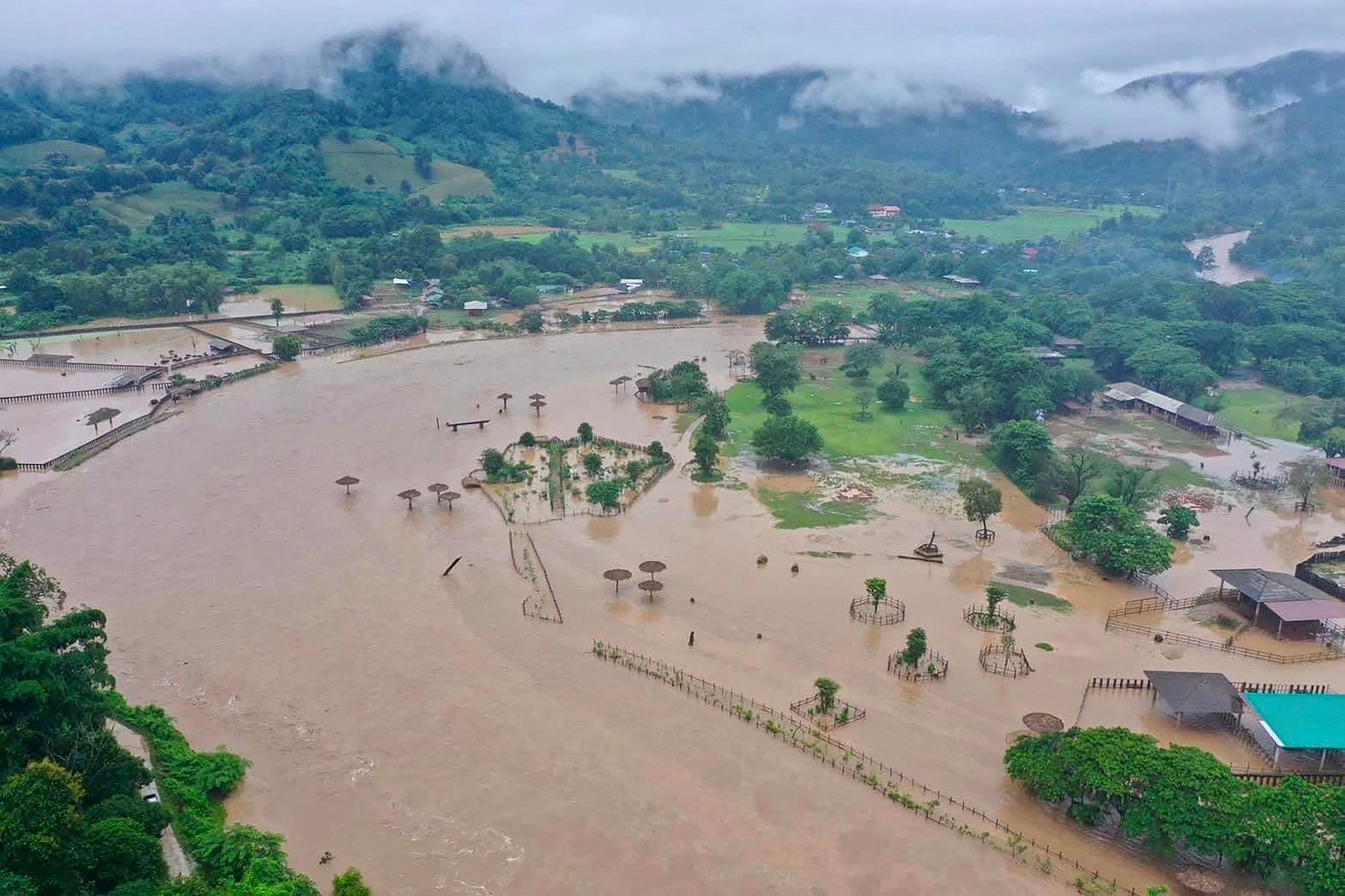 This aerial handout photo taken and released on October 3, 2024, by the Elephant Nature Park shows flood waters submerging the sanctuary in Thailand's northern Chiang Mai province. /CFP