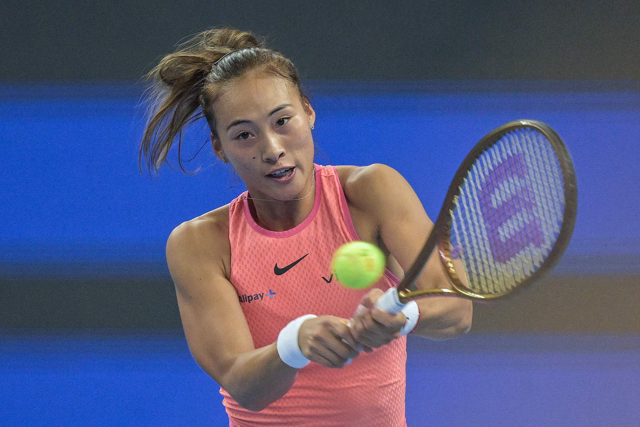 Zheng Qinwen of China hits a shot against Mirra Andreeva of Russia in the women's singles quarterfinals at the China Open in Beijing, October 4, 2024. /CFP