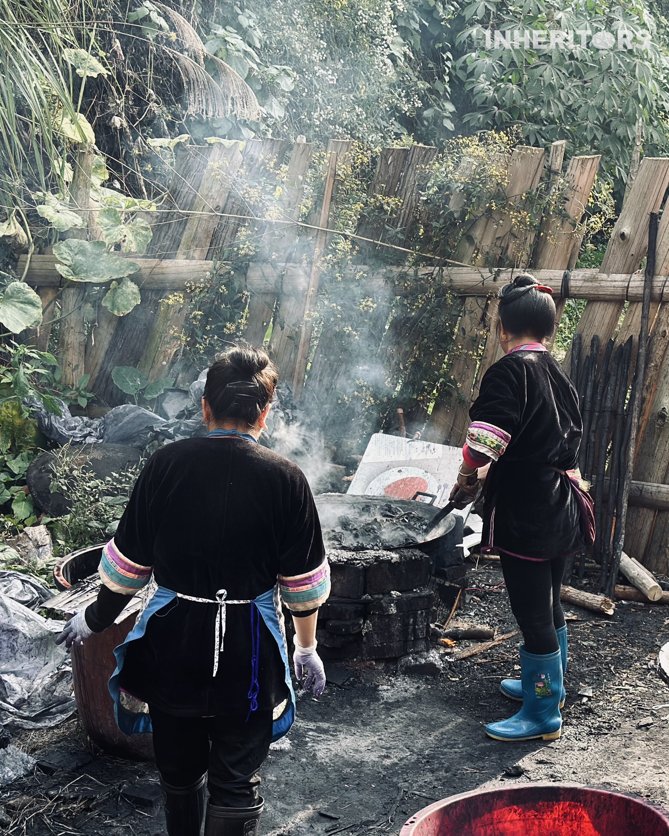 Women from the Dong ethnic group prepare dyestuff for traditional cloth at a village in southwest China's Guizhou Province. /CGTN 