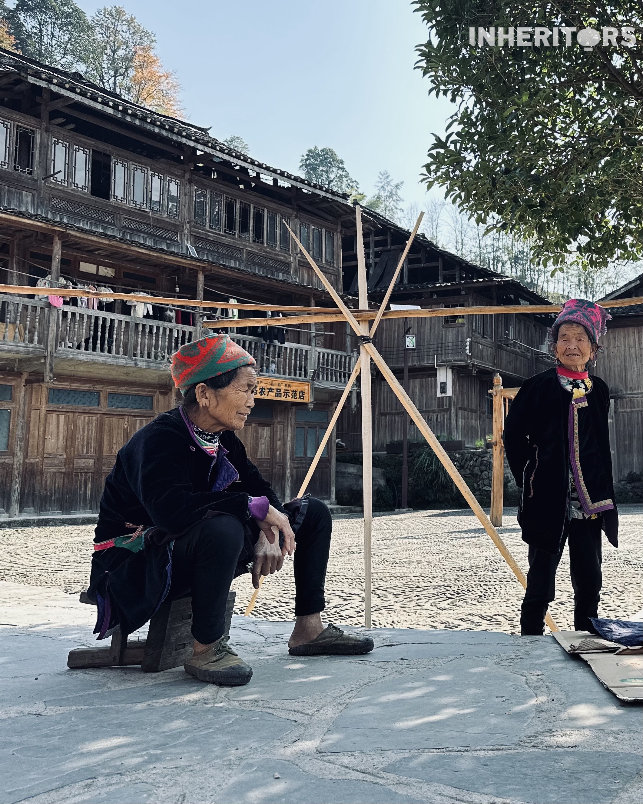 Two women from the Dong ethnic group are seen at a village in southwest China's Guizhou Province. /CGTN 