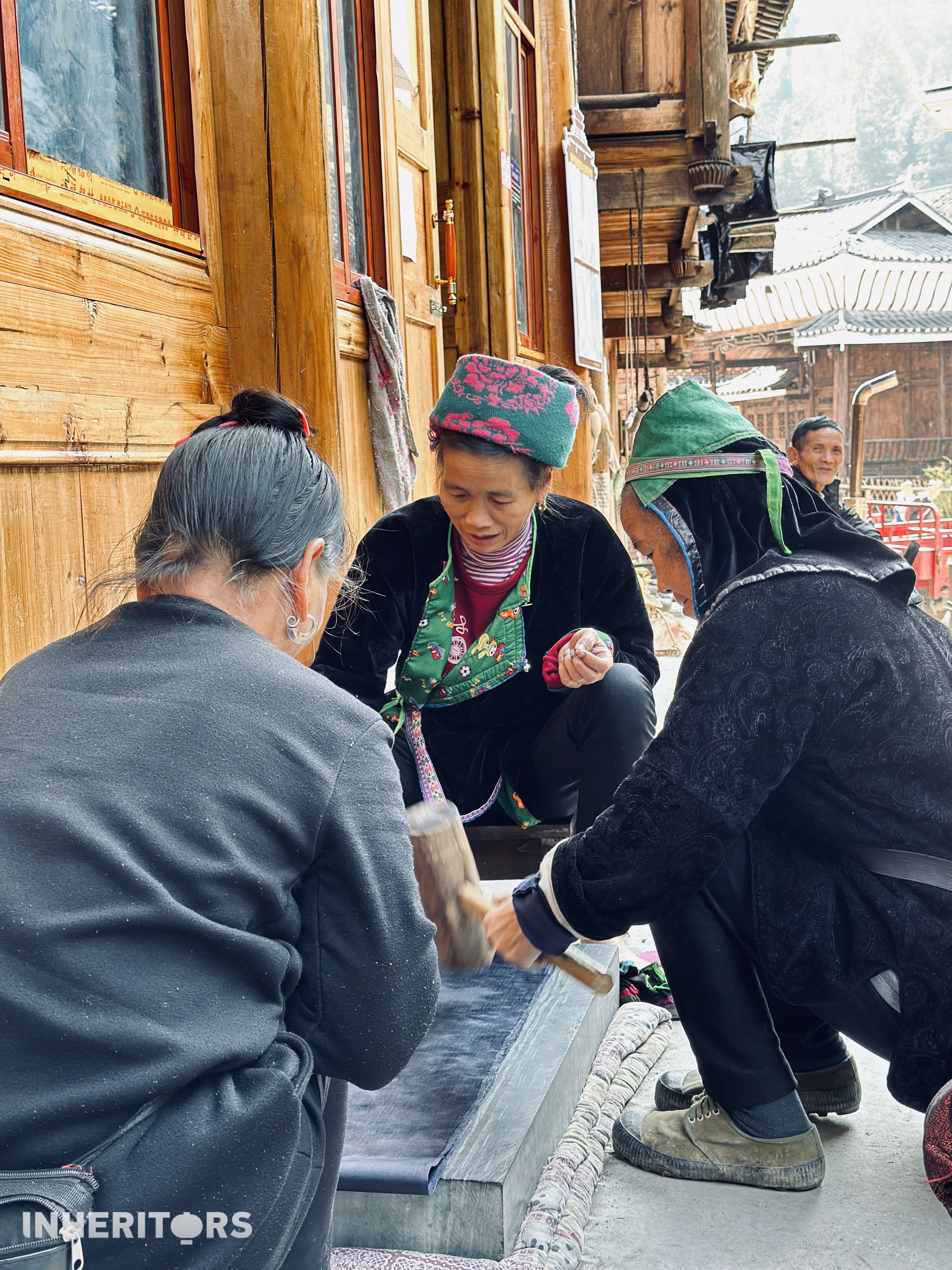 Women from the Dong ethnic group make traditional cloth at a village in southwest China's Guizhou Province. /CGTN