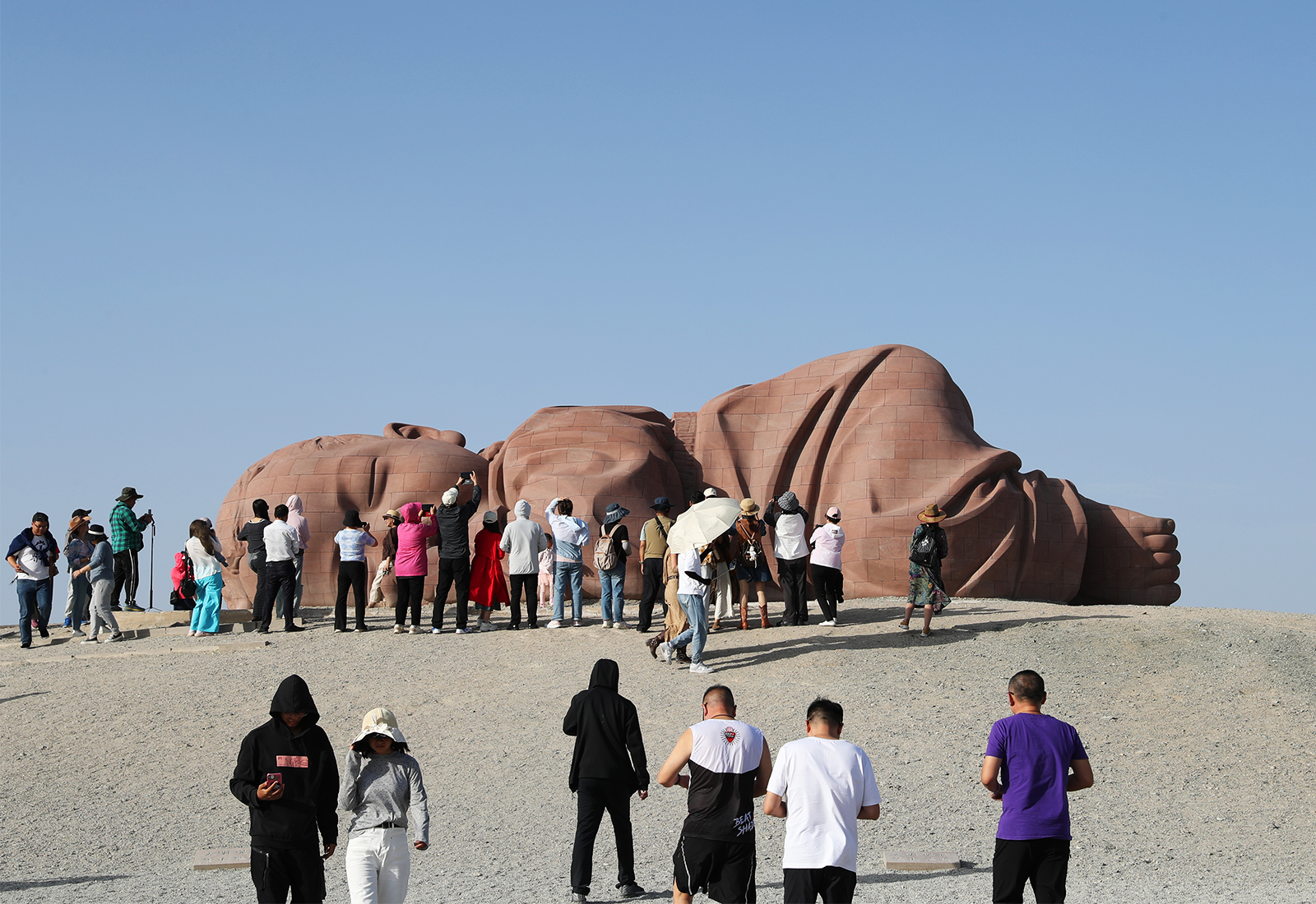 Visitors take photos around the 