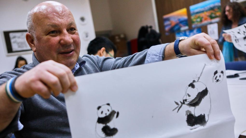 A student shows his painting during a Chinese painting class at the Confucius Institute of Sarajevo University in Sarajevo, Bosnia and Herzegovina, February 21, 2024. /Xinhua