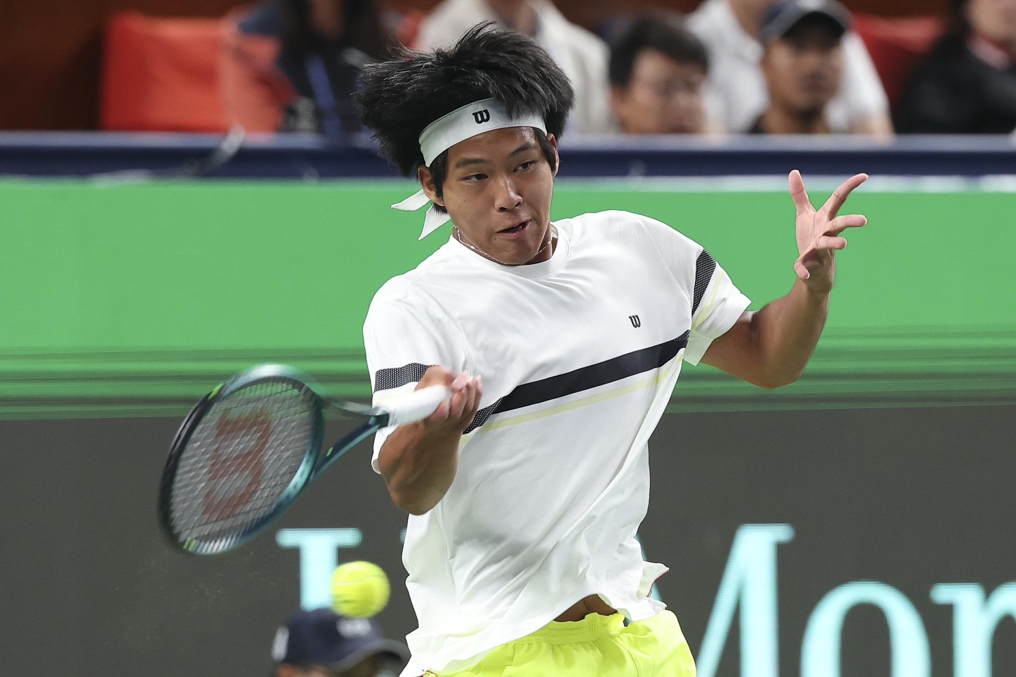 Zhou Yi of China hits a shot in the men's singles match against Frances Tiafoe of the U.S. at the Shanghai Masters in east China's Shanghai Municipality, October 7, 2024. /CFP