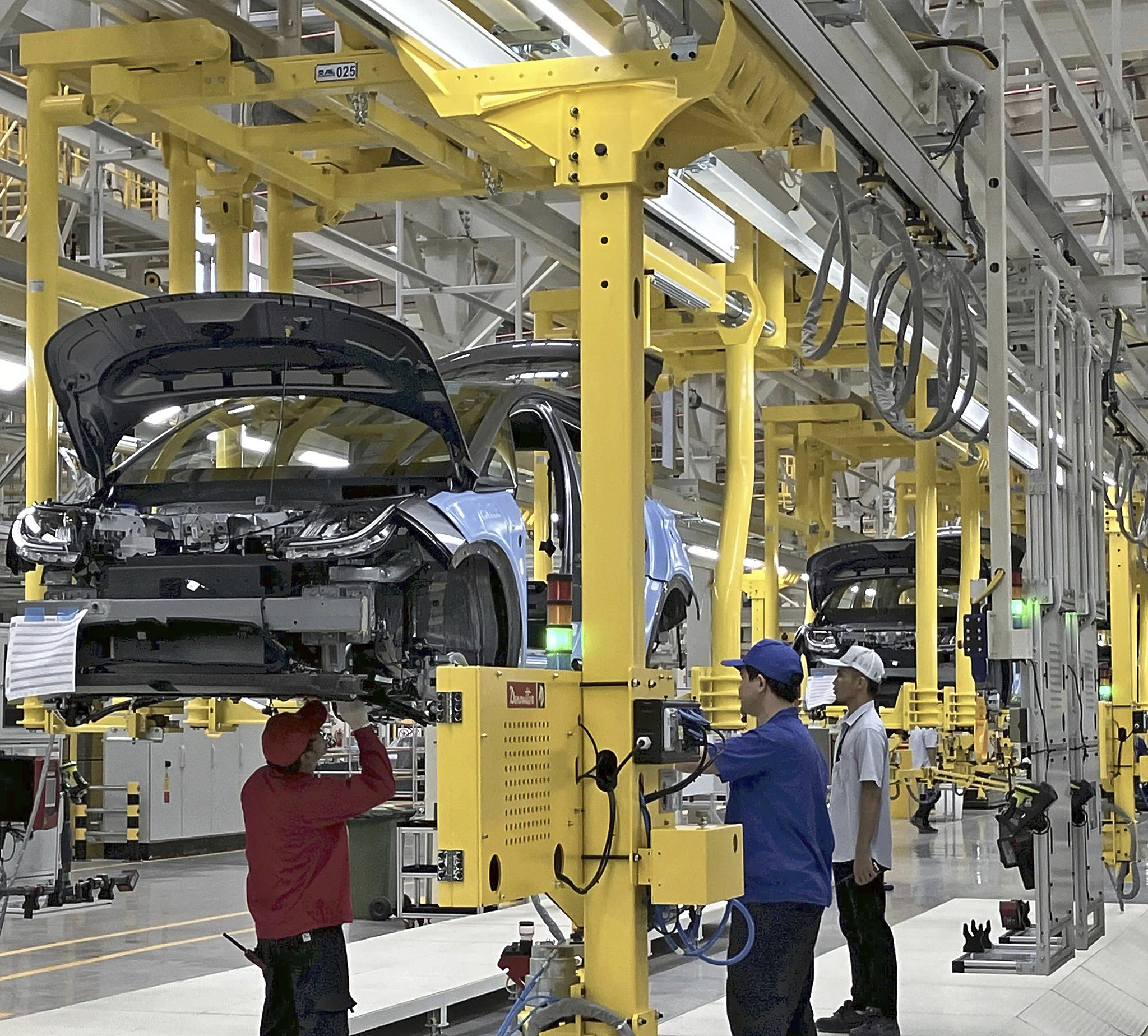 Workers assembling electric vehicles at a BYD plant in Thailand, July 4, 2024. /CFP