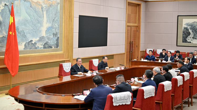 Chinese Premier Li Qiang, also a member of the Standing Committee of the Political Bureau of the Communist Party of China (CPC) Central Committee, presides over a symposium with experts and entrepreneurs to hear their views on China's current economic situation and the next steps on economic work, October 8, 2024. /Xinhua