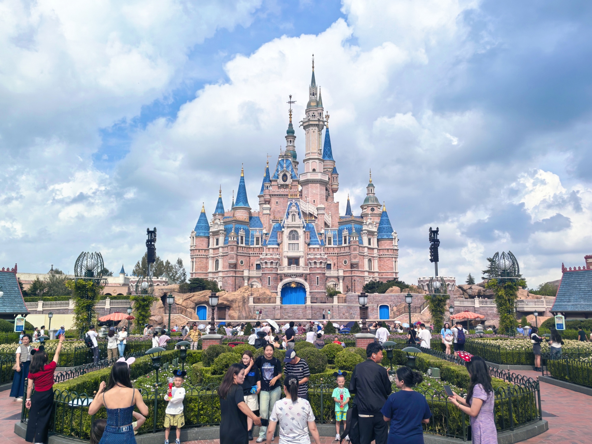 Tourists visit the Enchanted Storybook Castle in Shanghai Disneyland on September 30, 2024. /CGTN