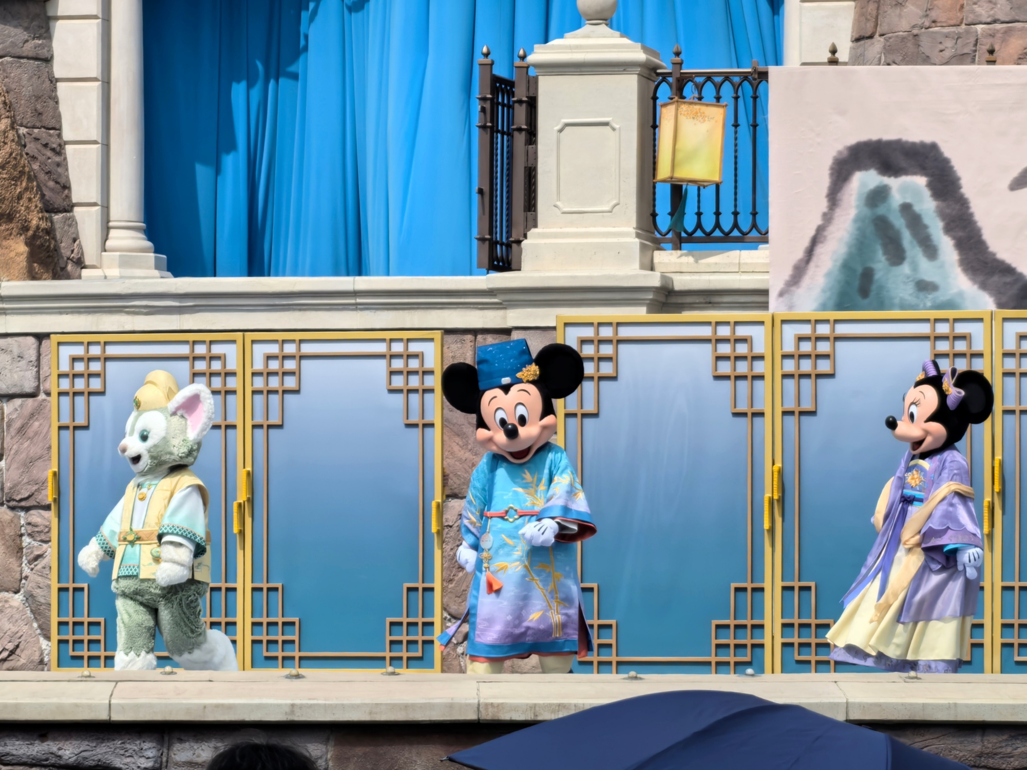 A performance is staged in front of the Enchanted Storybook Castle in Shanghai Disneyland on September 30, 2024. /CGTN