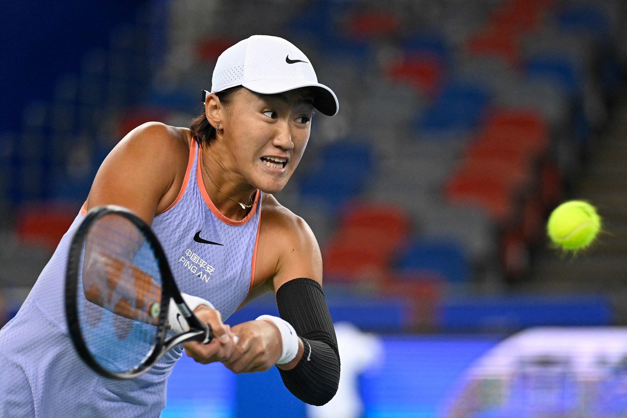 Wang Xiyu of China hits a shot in the women's singles match against Mira Andreeva of Russia at the Wuhan Open in Wuhan, central China's Hubei Province, October 8, 2024. /CFP