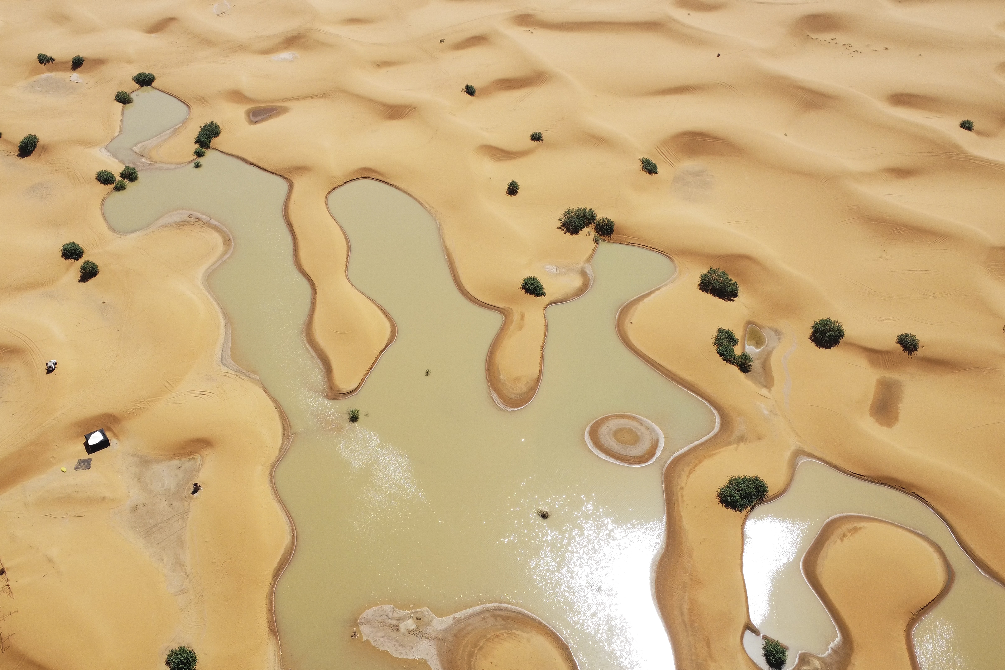 A view of lakes caused by heavy rainfall between sand dunes in the desert town of Merzouga, near Rachidia, southeastern Morocco, October 2, 2024. /AP