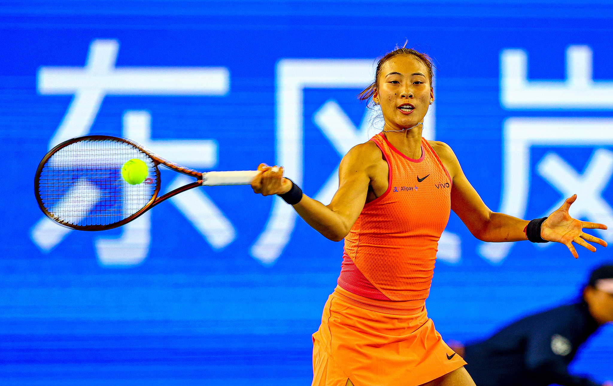 Zheng Qinwen of China hits a shot against Leylah Fernandez of Canada in the women's singles round of 16 at the Wuhan Open in Wuhan, central China's Hubei Province, October 10, 2024. /CFP