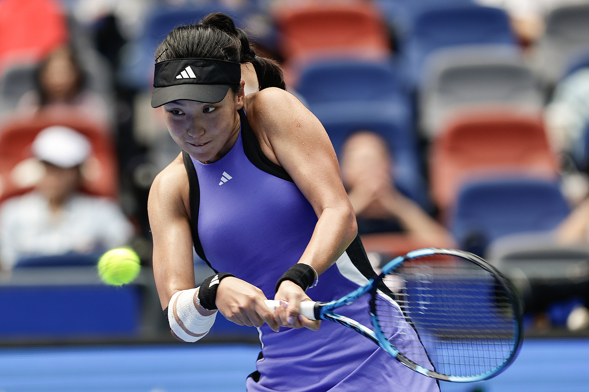 Wang Xinyu of China hits a shot against Jessica Pegula of the USA in the women's singles round of 16 at the Wuhan Open in Wuhan, central China's Hubei Province, October 10, 2024. /CFP