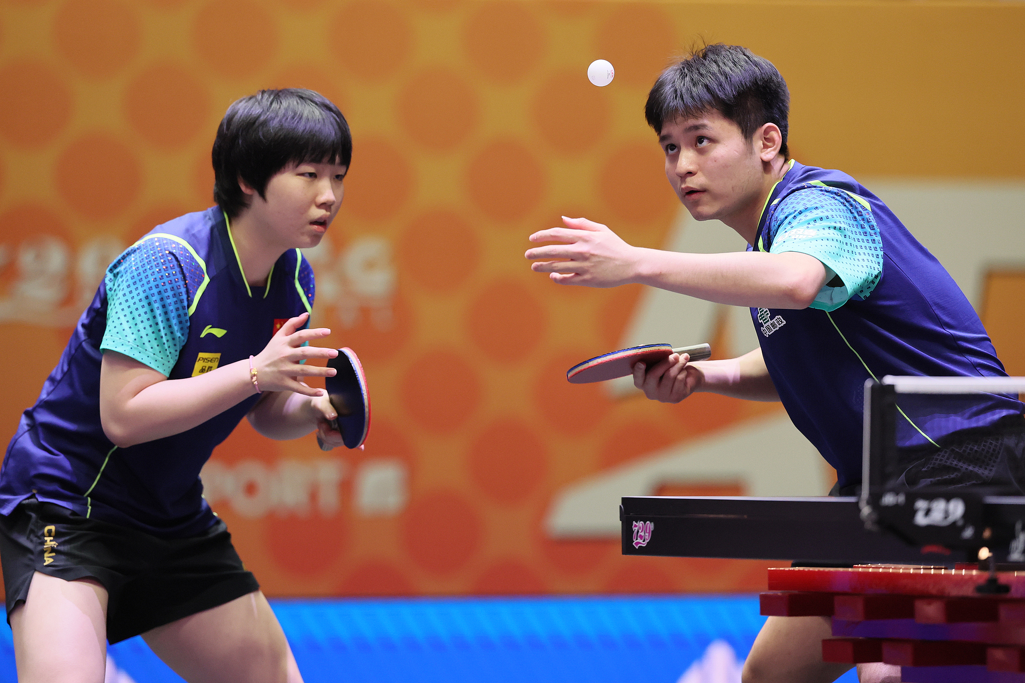 Lin Shidong (R) of China serves in the mixed doubles final while teaming with Kuai Man against Ri Jong Sik and Kim Kum Yong of the Democratic People's Republic of Korea (DPRK) at the Asian Table Tennis Championships in Astana, Kazakhstan, October 12, 2024. /CFP