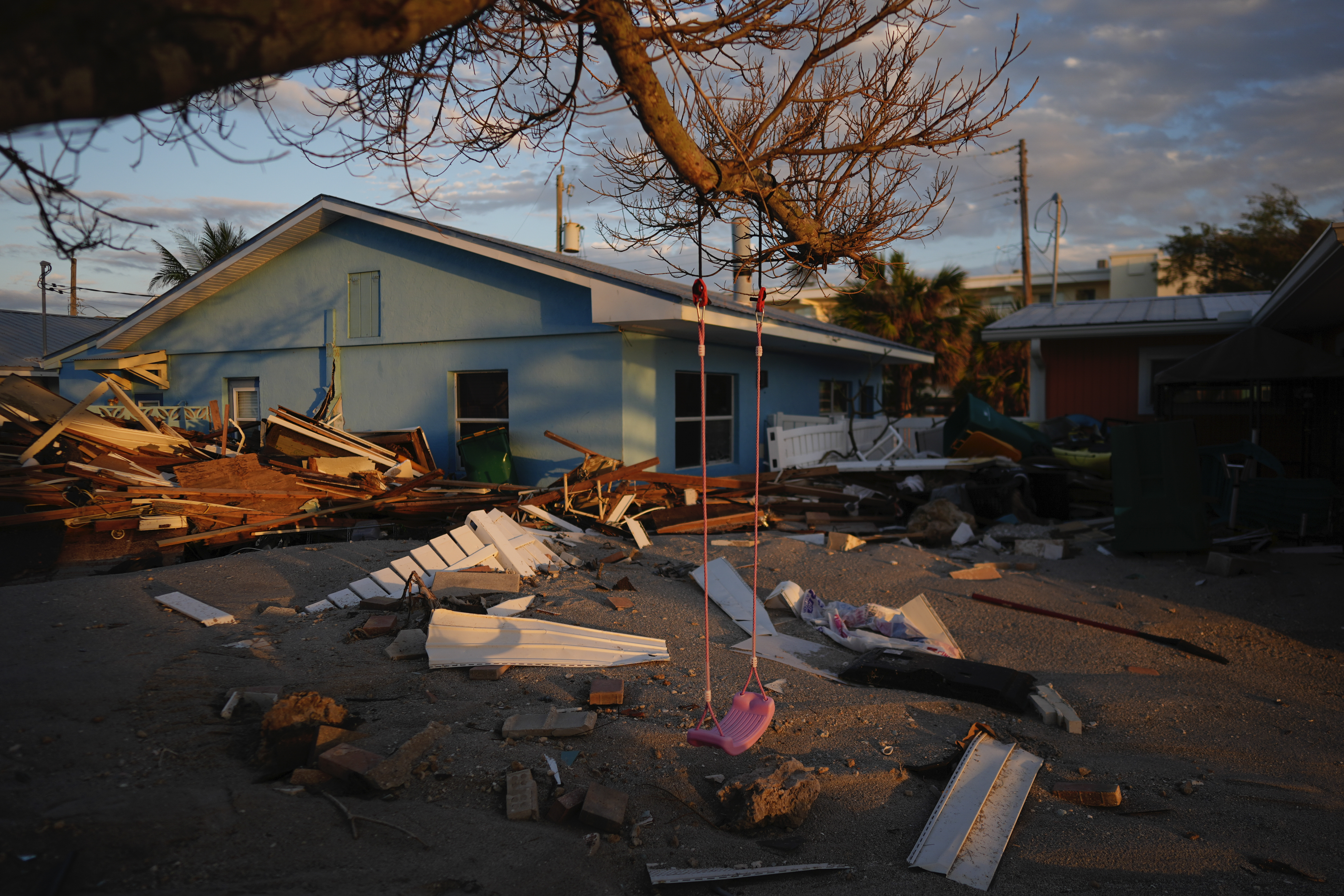 A child's swing still hangs on a tree, surrounded by debris from homes destroyed by Hurricane Milton, Manasota Key, Florida, United States, October 12, 2024. /AP