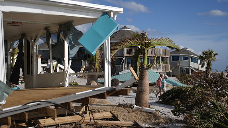 A damaged home and the displaced roof a mobile home community's tiki hut after the passage of Hurricane Milton on Manasota Key in Englewood, Florida October 13, 2024. /CFP