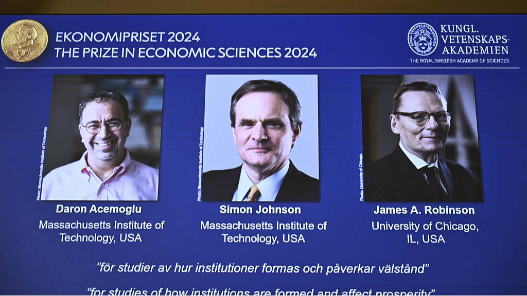 The Nobel prize in economics awarded to Daron Acemoglu, Simon Johnson and James A Robinson, as seen on screen during a press meeting at the Royal Swedish Academy of Sciences in Stockholm, Sweden on October 14, 2024. /CFP