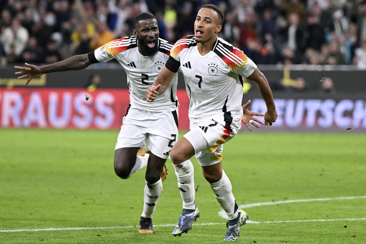 Germany's Jamie Leweling (R) celebrates with teammate Antonio Ruediger after scoring the opening goal against the Netherlands in a UEFA Nations League Group A3 match in Munich, Germany, October 14, 2024. /CFP