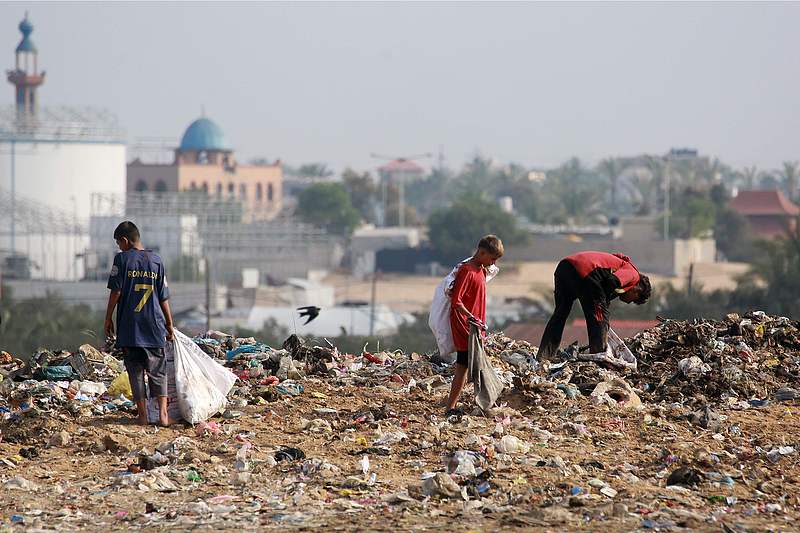 Children sift through waste at a landfill in Khan Yunis in the southern Gaza Strip, October 15, 2024. /CFP