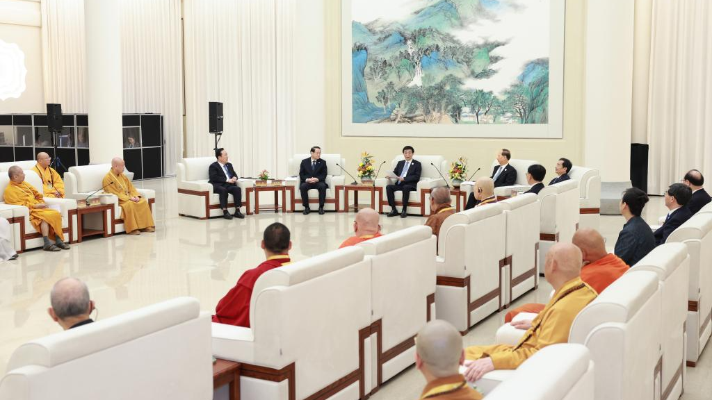 Wang Huning, a member of the Standing Committee of the Political Bureau of the Communist Party of China Central Committee and chairman of the National Committee of the Chinese People's Political Consultative Conference, meets with representatives participating in the sixth World Buddhist Forum prior to the opening ceremony in Ningbo City, east China's Zhejiang Province, October 15, 2024. /Xinhua