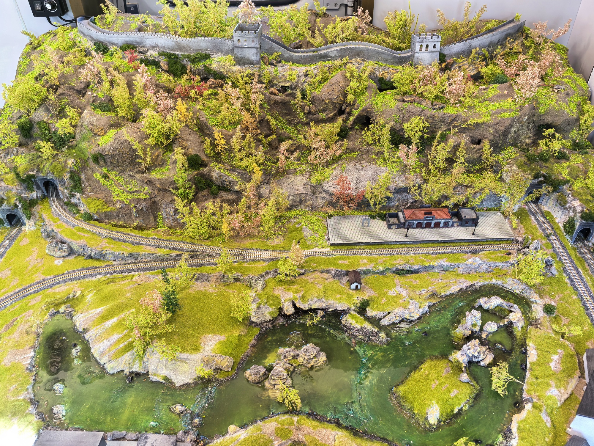 A model shows the section of the Jingzhang Railway at the foot of the Great Wall, at a retired green carriage turned museum at the Jingzhang Railway Park in Beijing on September 17, 2024. /CGTN