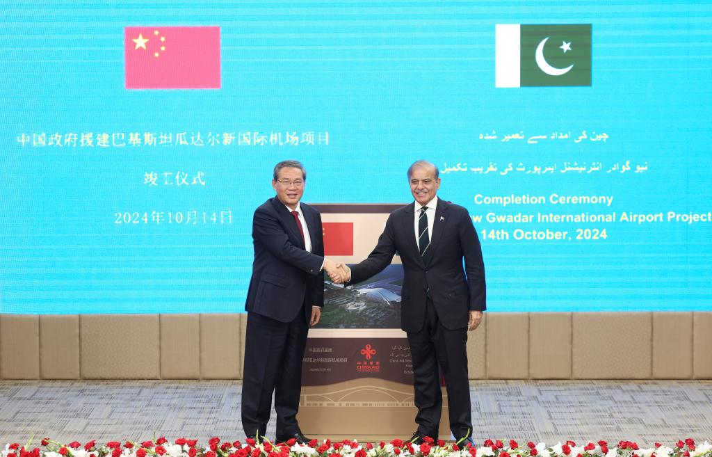 Chinese Premier Li Qiang (L) attends a ceremony with Pakistani Prime Minister Shehbaz Sharif to mark the completion of the New Gwadar International Airport project at the Prime Minister's Office in Islamabad, Pakistan, on Oct. 14, 2024. /Xinhua