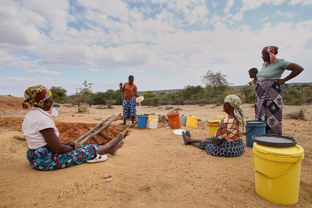 Women take their turn to draw water at a village well, which has very limited reserves of water left to meet their household water needs for drinking, cooking and sanitation as the water table has been severely depleted as the El-Nino induced drought, Mudzi, Zimbabwe, July 2, 2024. /CFP