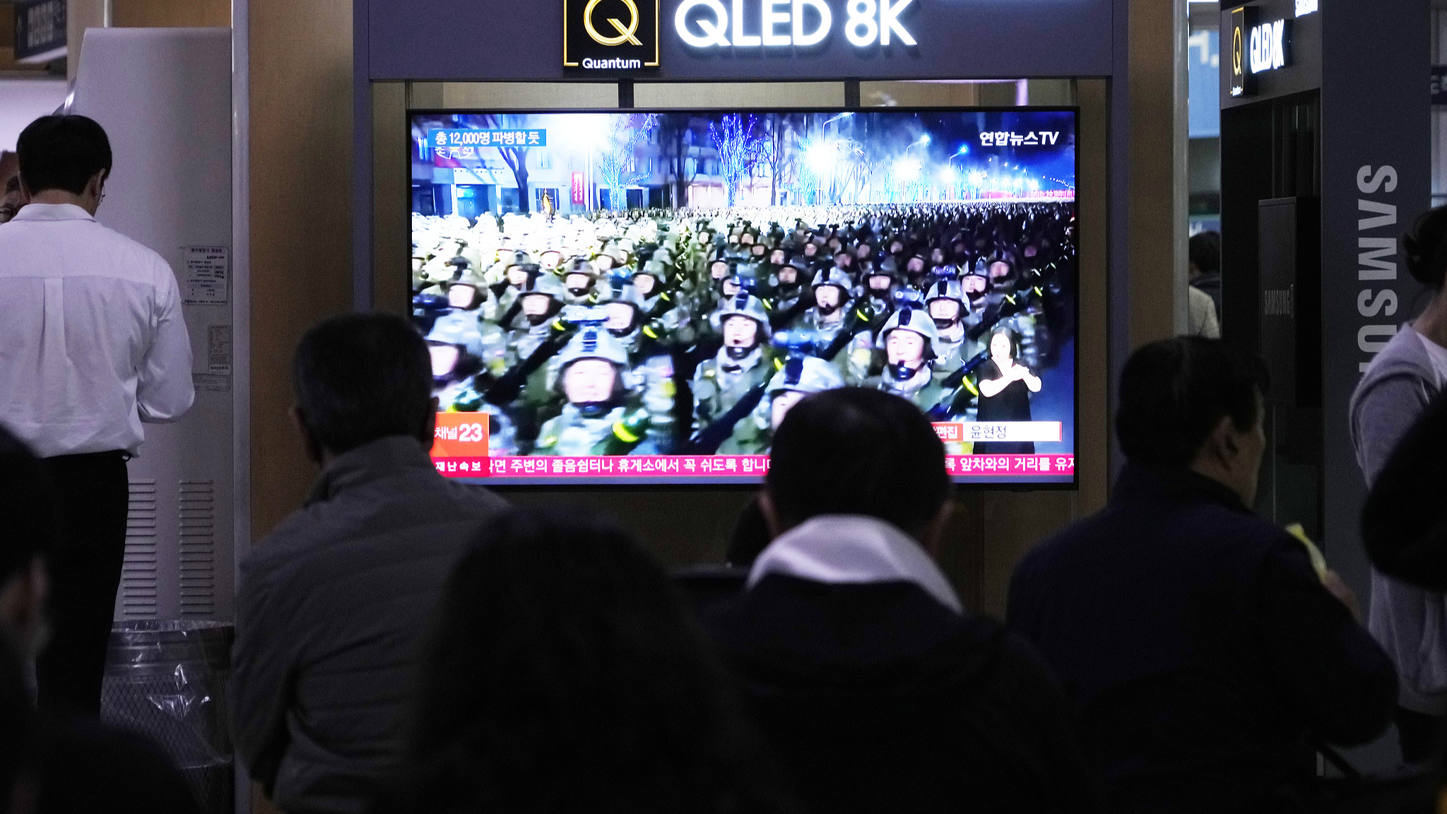 A TV screen shows file images of DPRK soldiers during a news program at Seoul Railway Station in Seoul, South Korea, October 18, 2024. /CFP