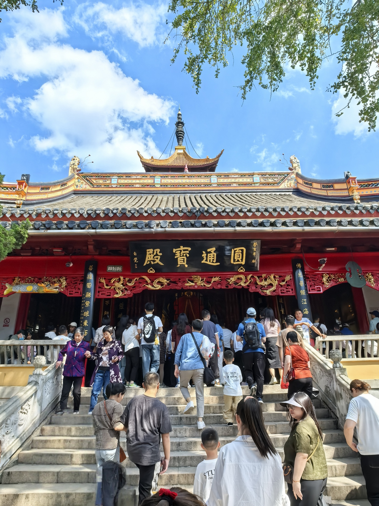 Tourists visit a temple at Langshan, or Wolf Hill, in Nantong, east China's Jiangsu Province, on October 3, 2024. /CGTN