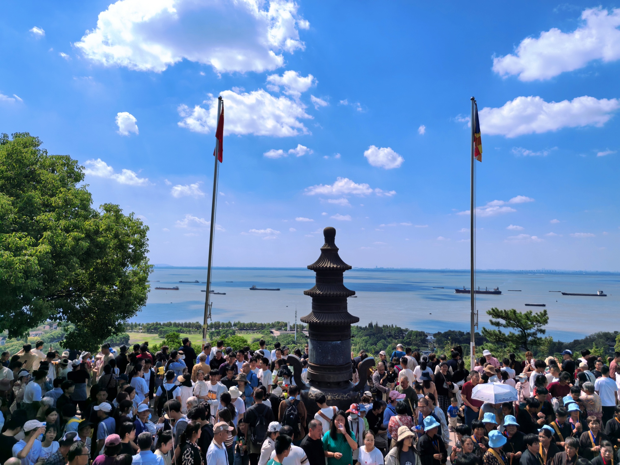 Tourists visit Langshan, or Wolf Hill, in Nantong, east China's Jiangsu Province, on October 3, 2024. /CGTN