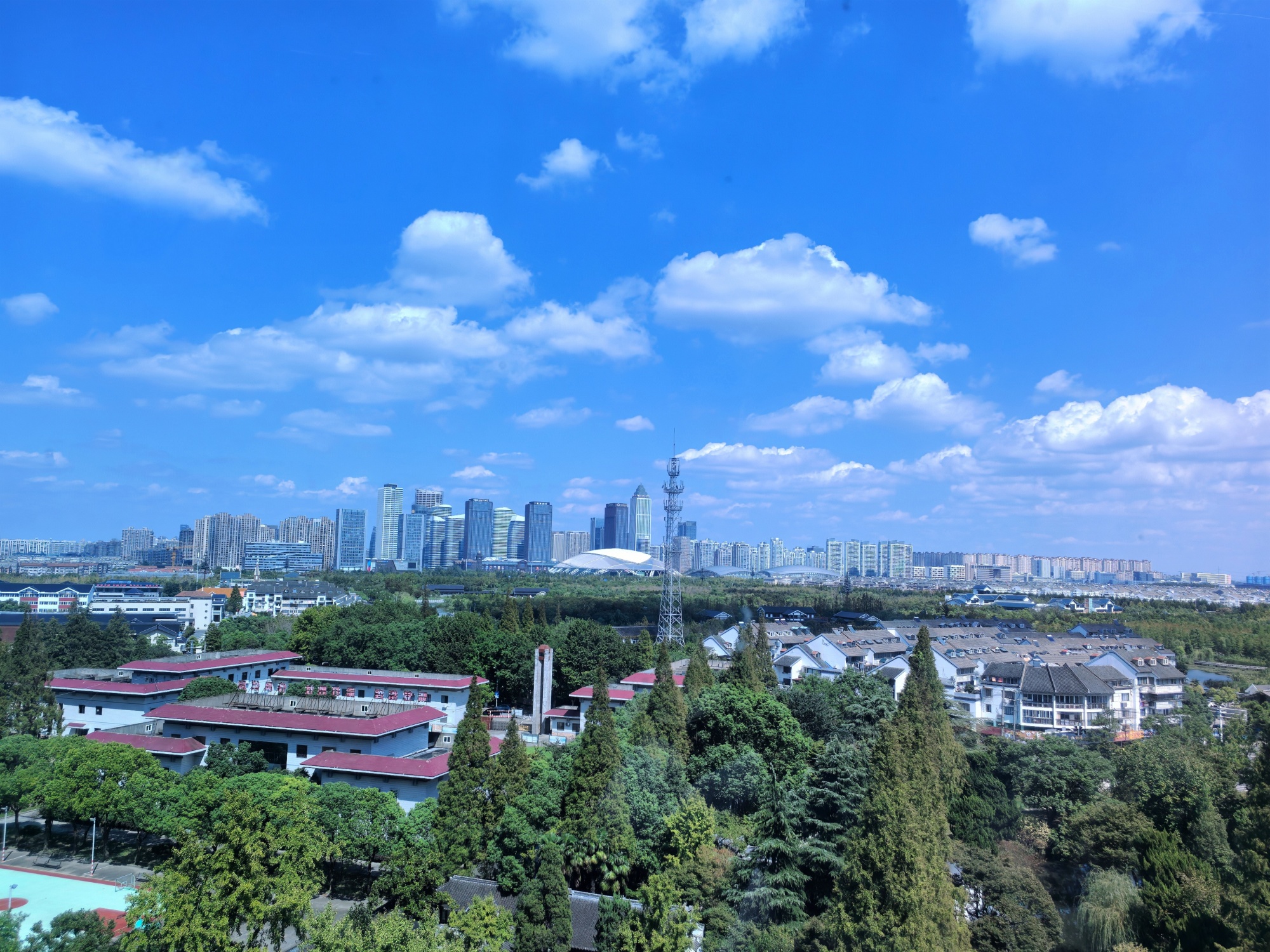 This photo taken on October 3, 2024 shows the skyline of Nantong city seen from Langshan, or Wolf Hill, in east China's Jiangsu Province, on October 3, 2024. /CGTN