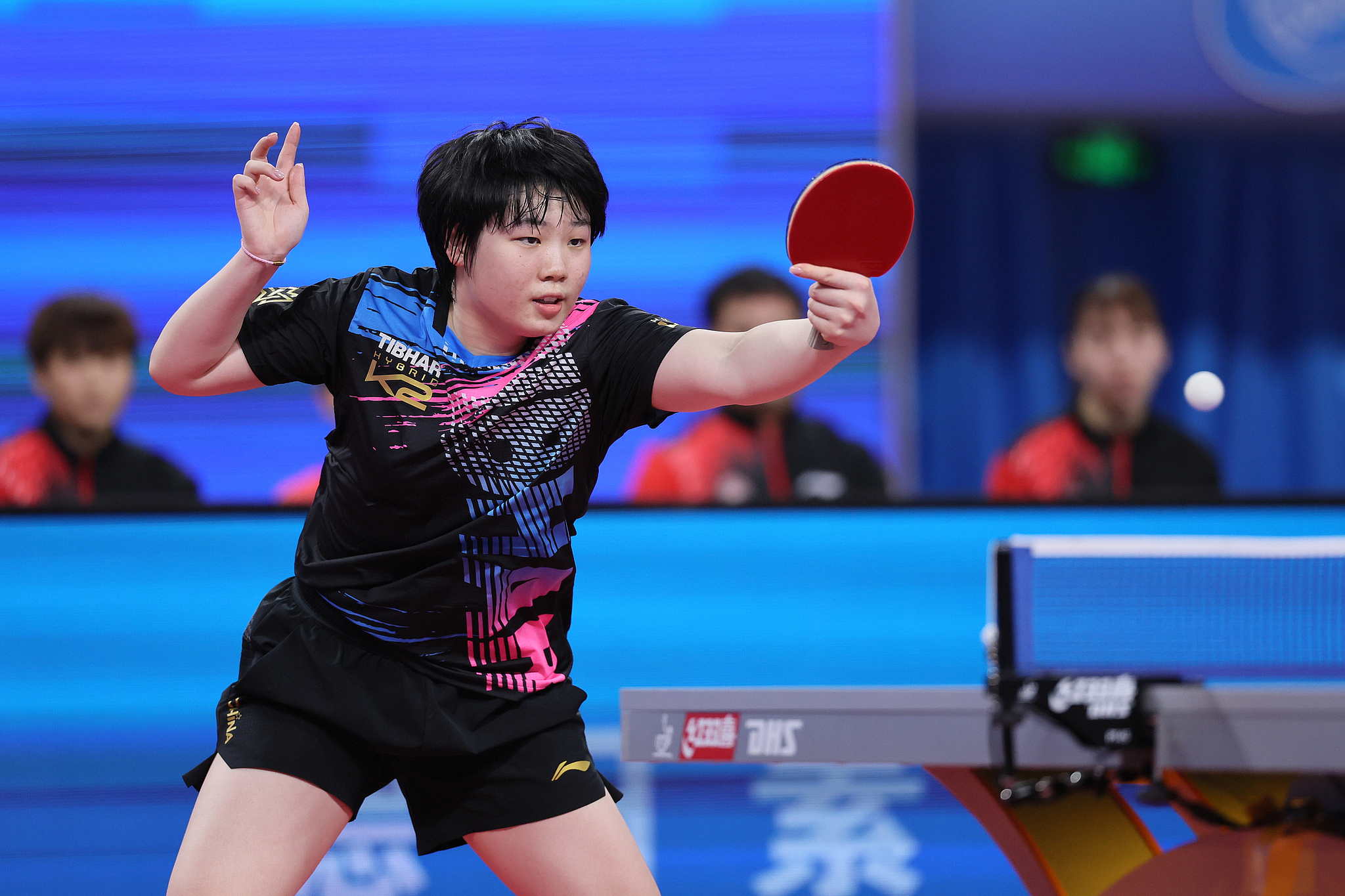 Kuai Man of Jiangsu Province hits a shot in the women's team final against Shanghai Municipality at the All China Table Tennis Championships in Ordos, north China's Inner Mongolia Autonomous Region, October 19, 2024. /CFP