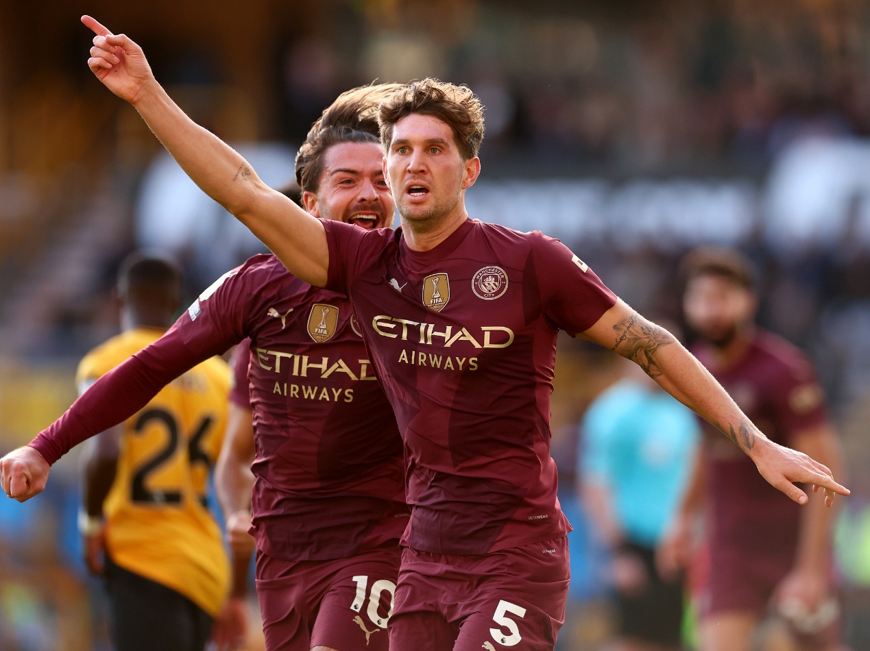 John Stones (#5) of Manchester City celebrates scoring an injury time winner during their clash with Wolves at Molineux in Wolverhampton, England, October 20, 2024. /CFP