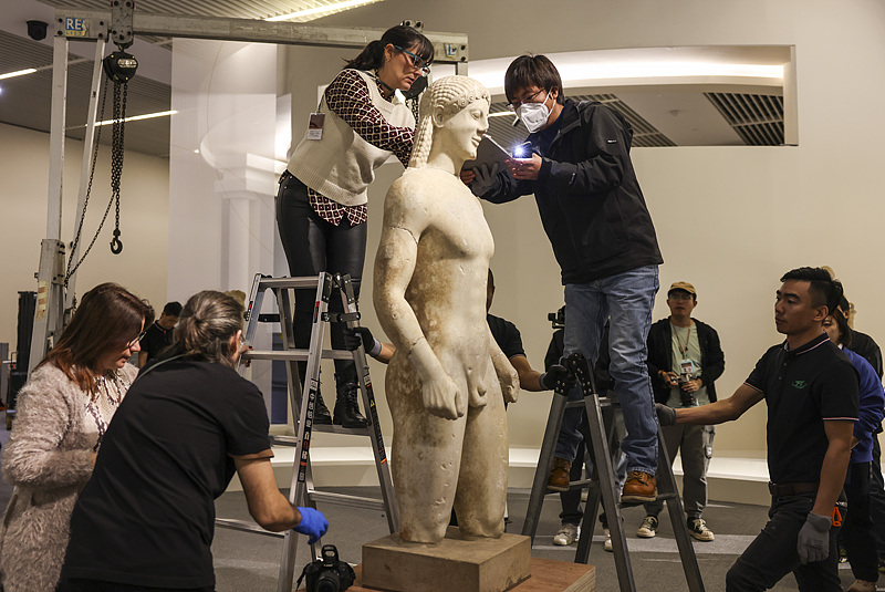 Staff members busily prepare for the upcoming exhibition on ancient Greece at the National Museum of China in Beijing, October 21, 2024. /CFP