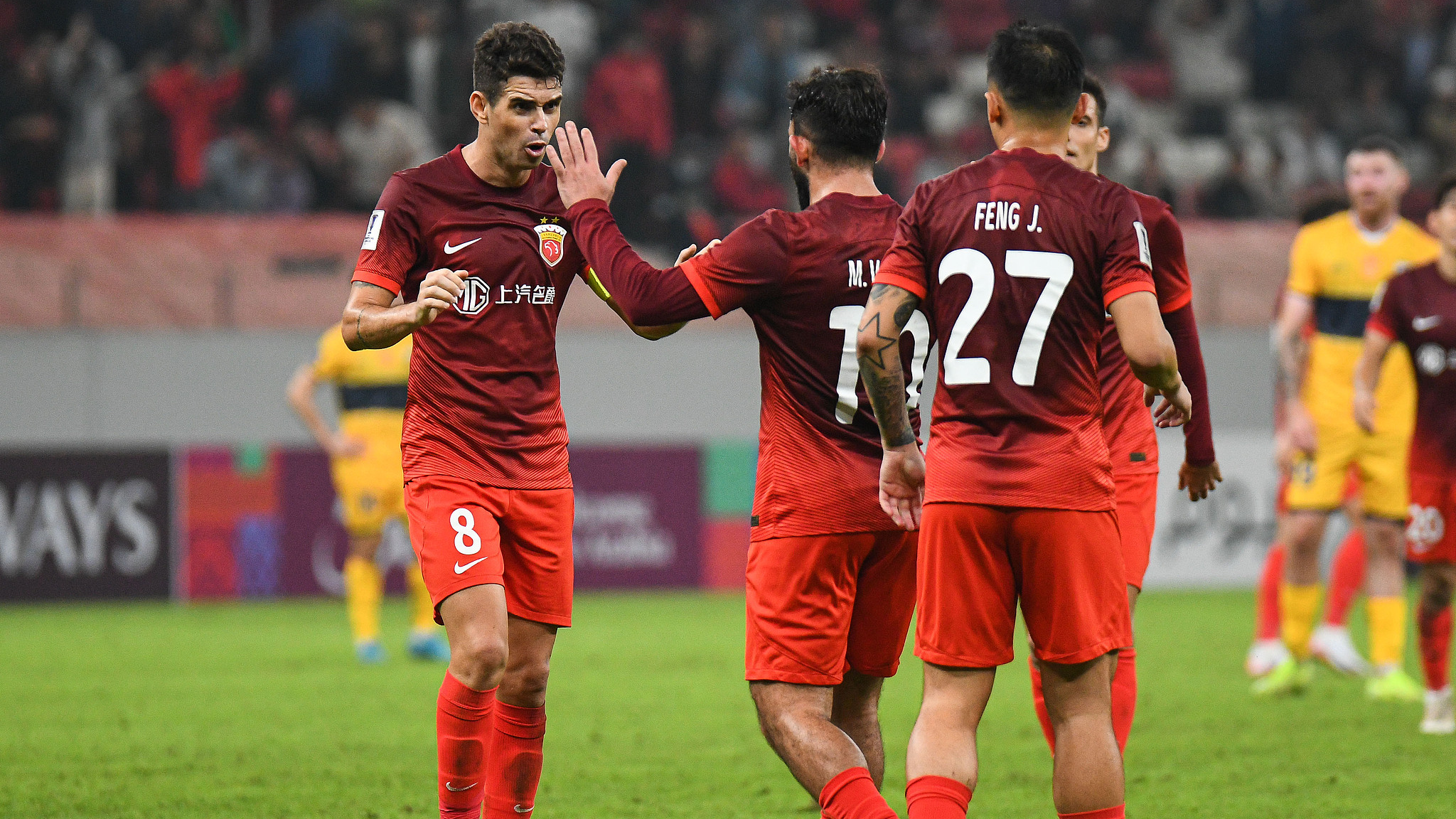 Shanghai Shanggang players celebrate beating Central Coast Mariners in an AFC Champions League Elite match in Shanghai, China, October 22, 2024. /CFP