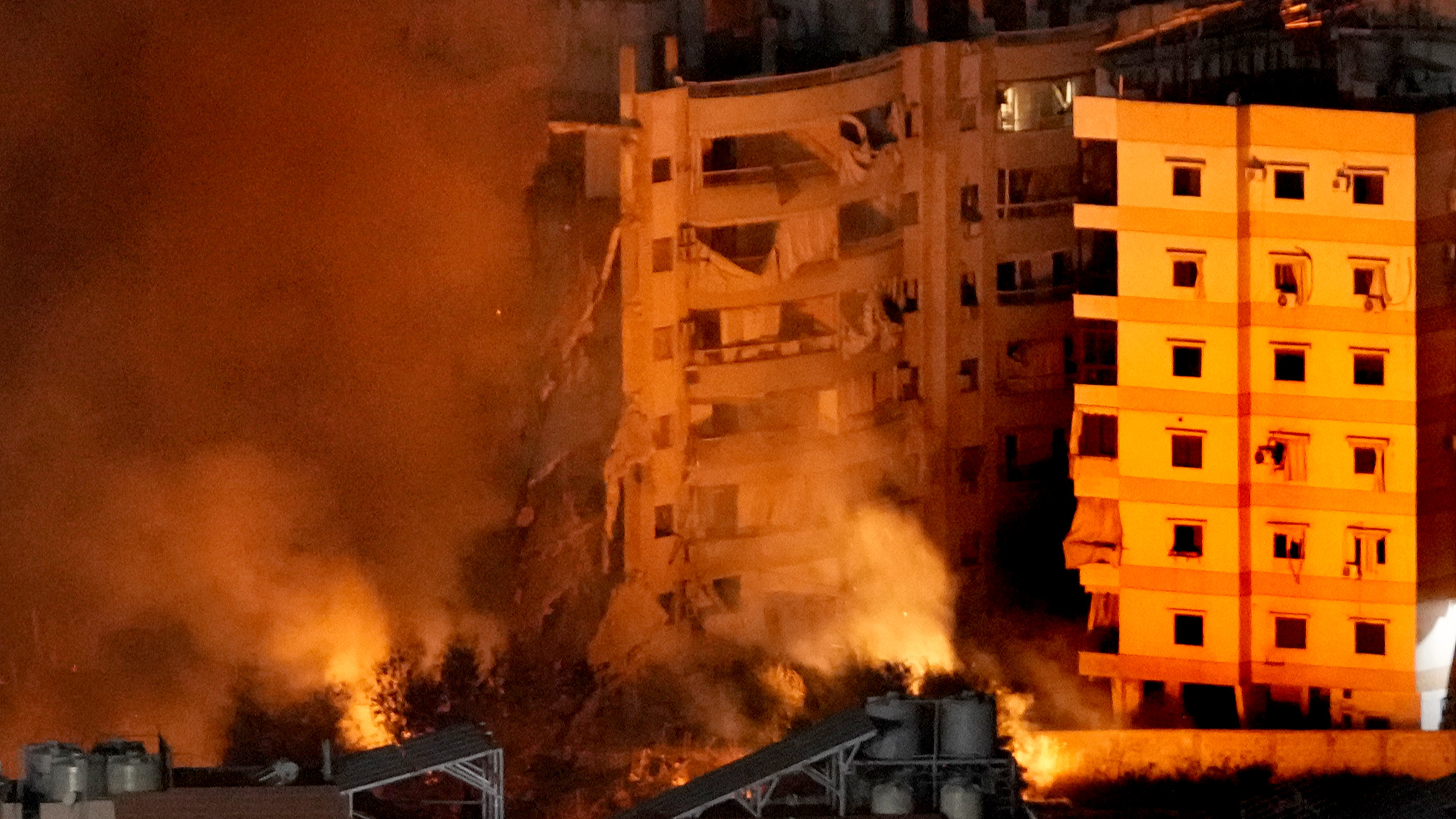 Flames and smoke rise from buildings hit by Israeli air strikes on Dahiyeh, in the southern suburb of Beirut, Lebanon, October 23, 2024. /CFP 