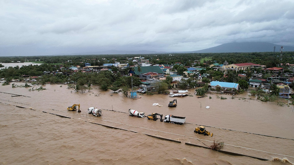 An aerial view shows inundated construction vehicles and flooded houses as Tropical Storm Trami brought heavy rains, Bato Town, Camarines Sur Province, Bicol Region, the Philippines, October 24, 2024. /CFP