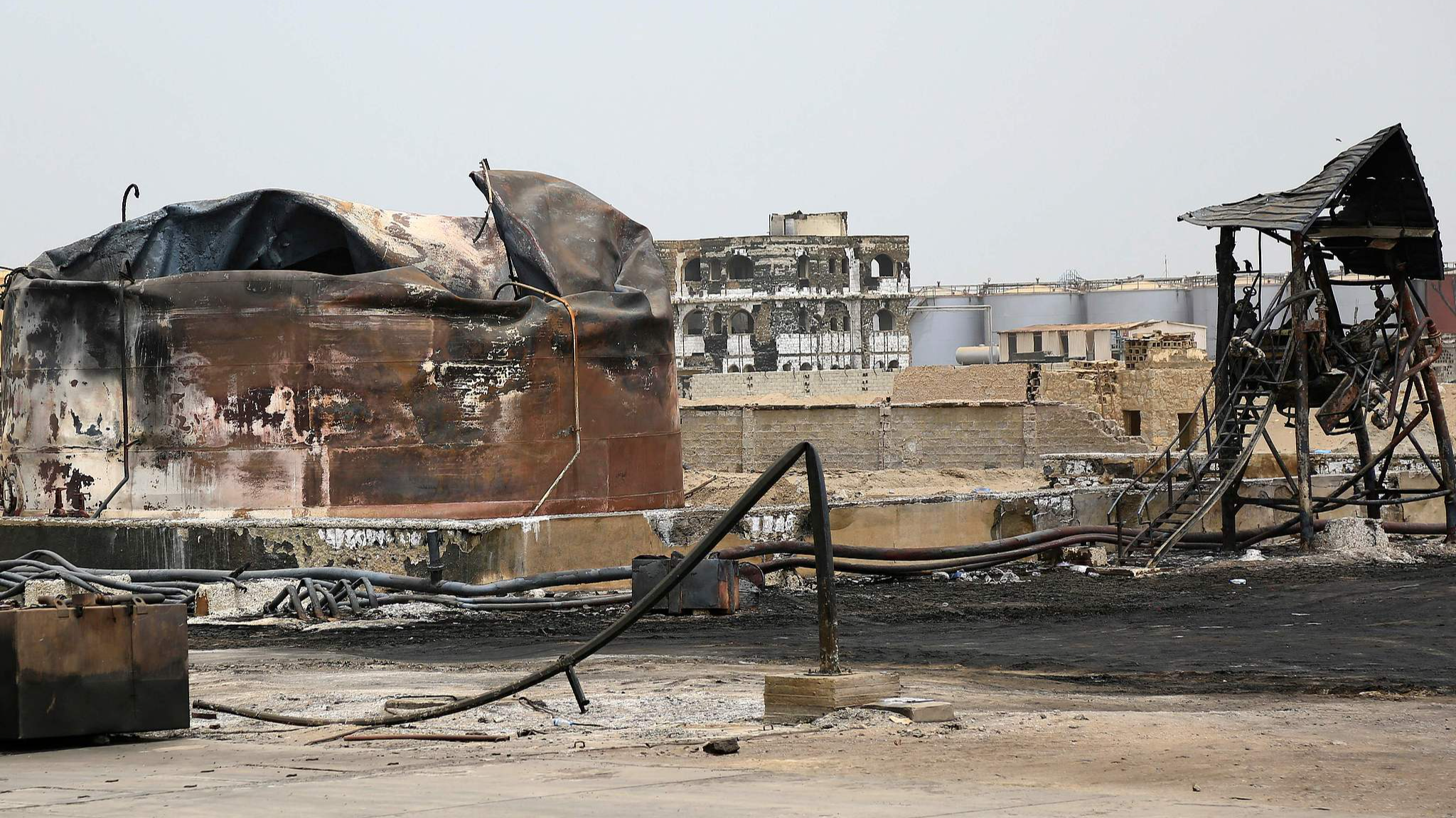 A charred oil tank stands at an oil storage facility five days after Israeli strikes, in Yemen's Houthi-held port city of Hodeida, July 25, 2024. /CFP