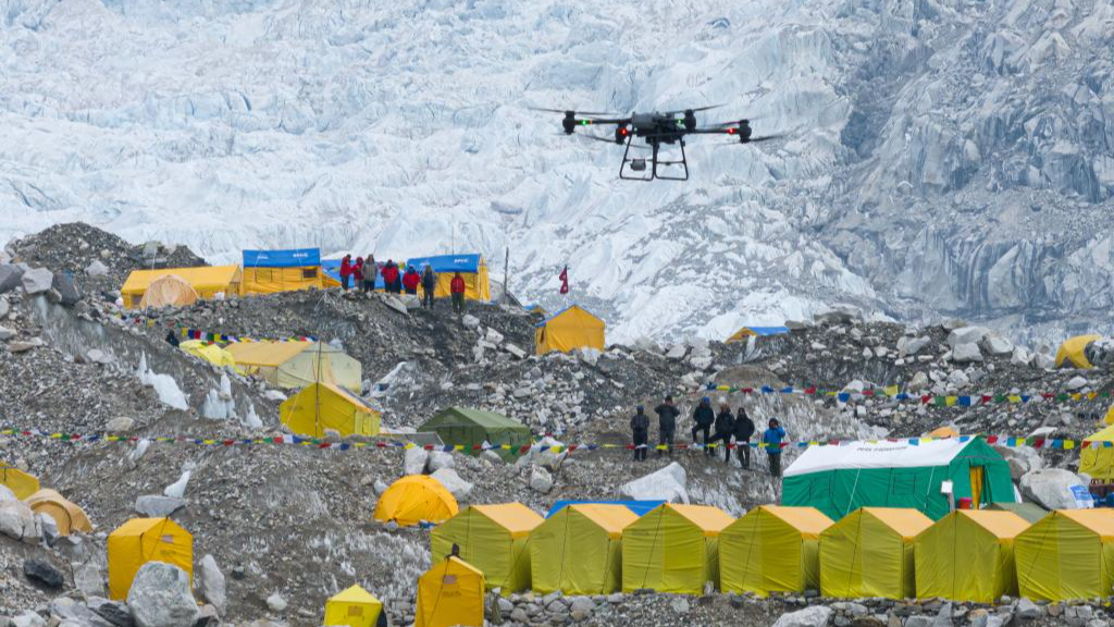 Snapshot taken from a video shows a DJI drone taking off for a delivery test from the Base Camp on Mount Qomolangma, April 30, 2024. /Xinhua