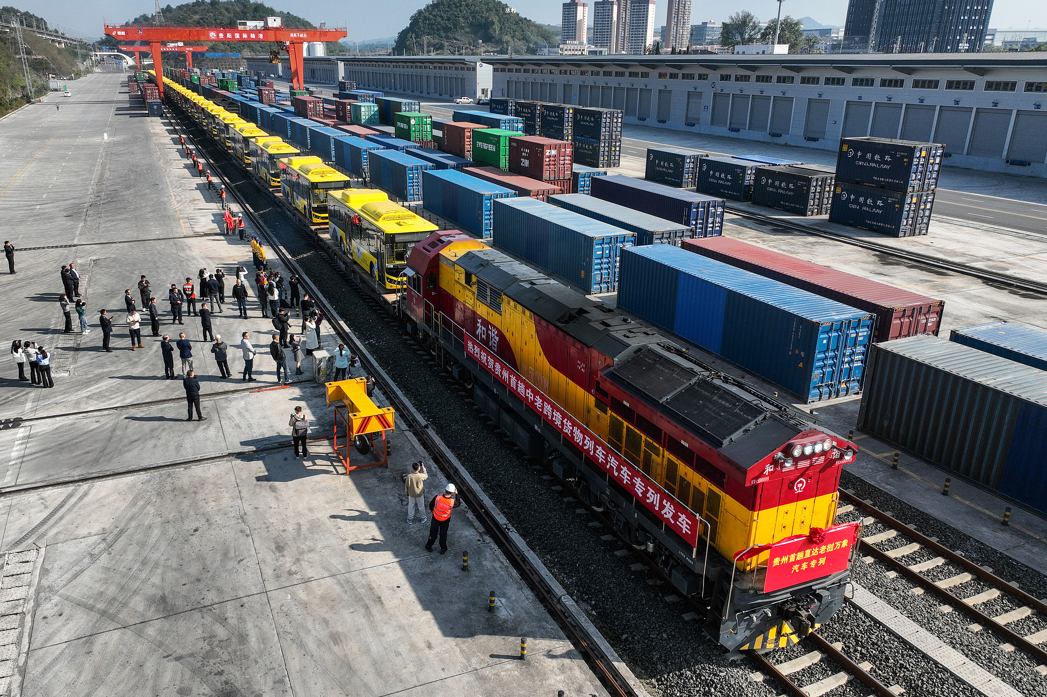 A train loaded with 28 China-made new energy buses departs from Dulaying International Land-Sea Logistics Port in Guiyang, Guizhou Province, en route to Vientiane, Laos, October 28, 2024. /CFP
