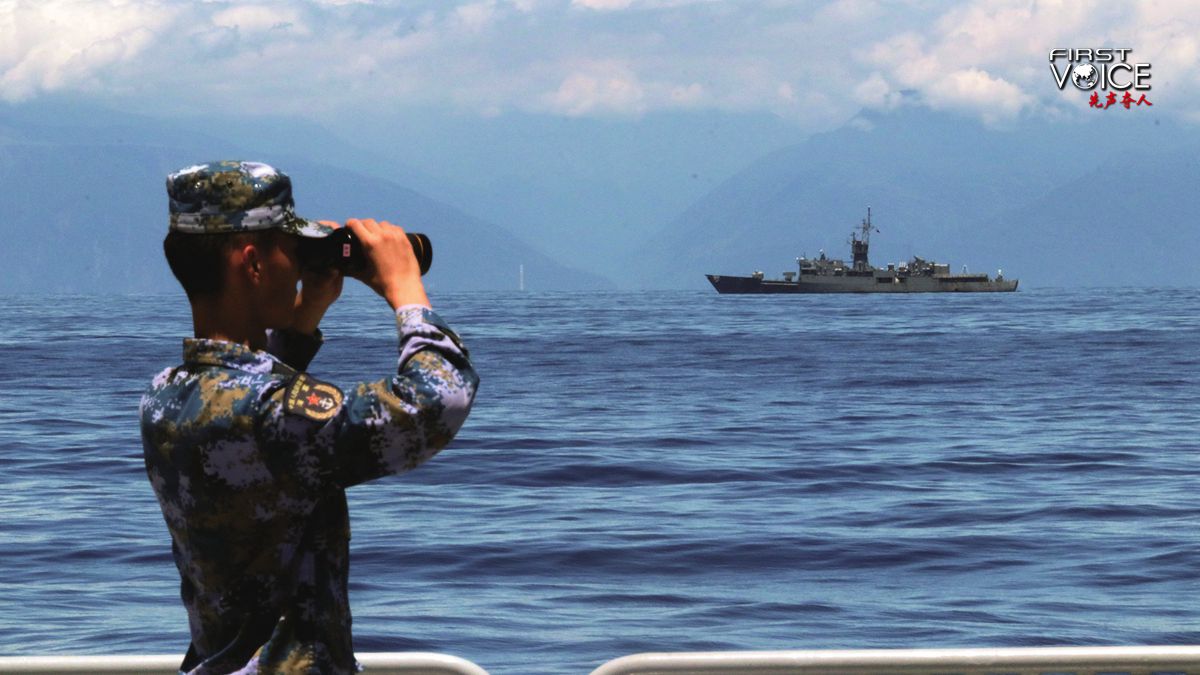 A PLA soldier looks around with a telescope near the waters around the island of Taiwan, August 5, 2022. /Xinhua