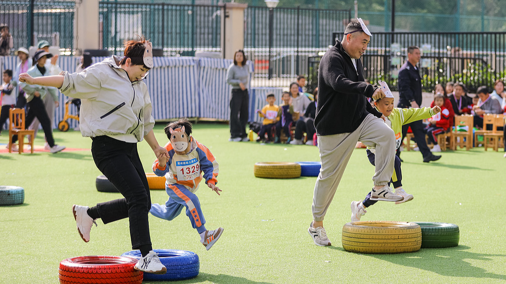 Parents and children participate in physical activities together at a kindergarten, Qingdao City, east China's Shandong Province, October 25, 2024. /CFP