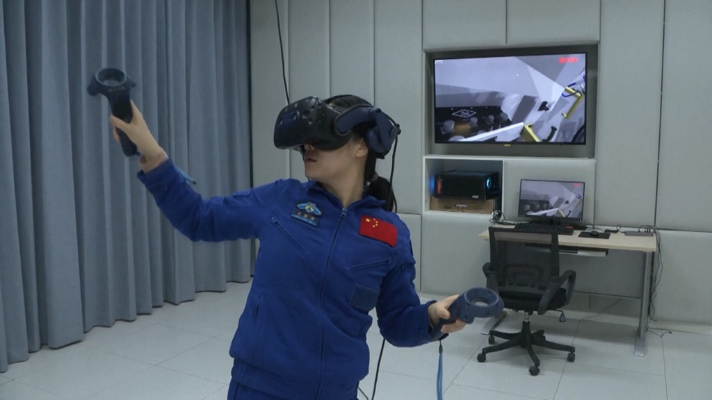 A screenshot from a CMG video shows Wang Haoze trains with virtual reality device.