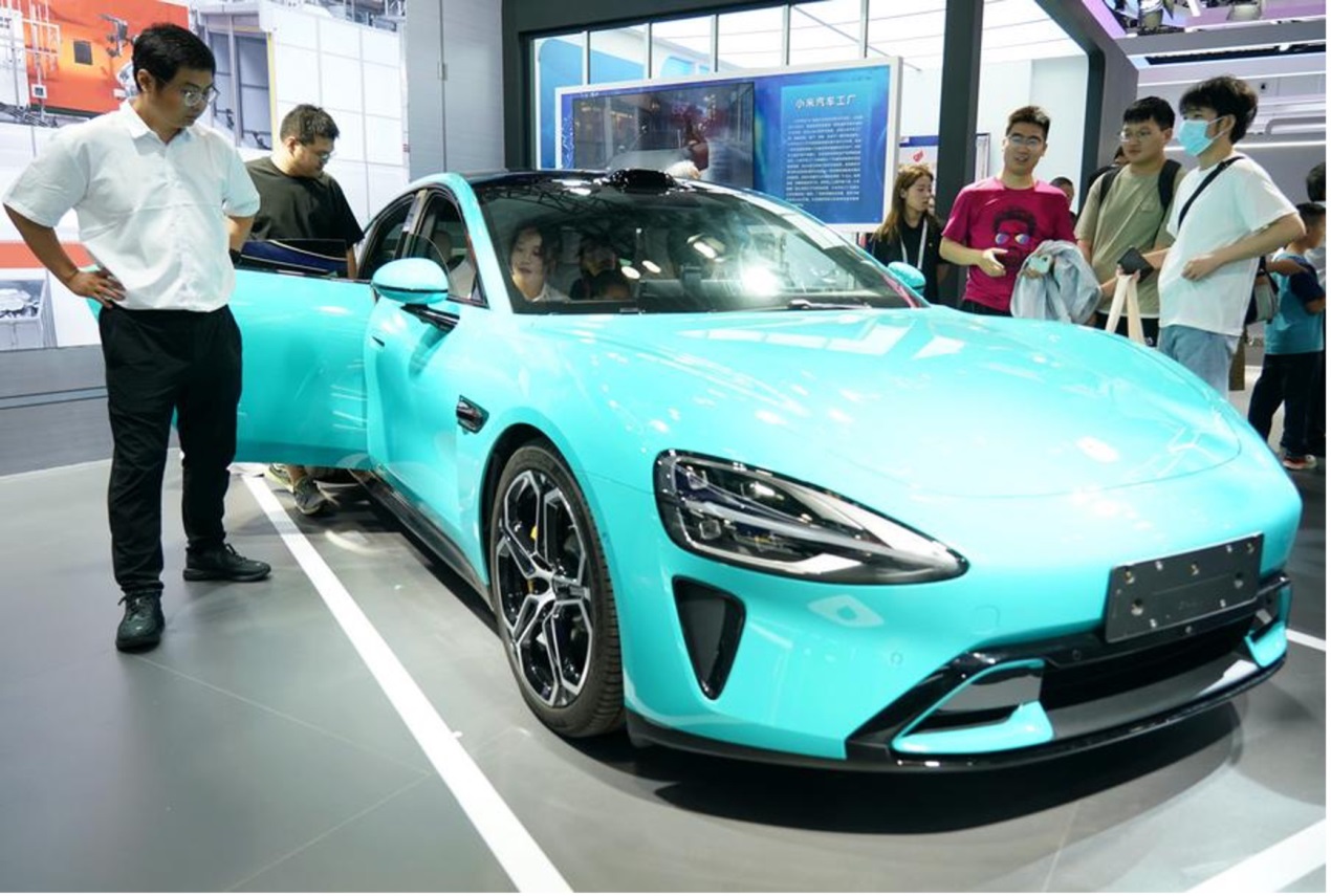 People view a new energy vehicle on display at the 26th China Beijing International High-tech Expo in Beijing, capital of China, July 13, 2024. /Xinhua